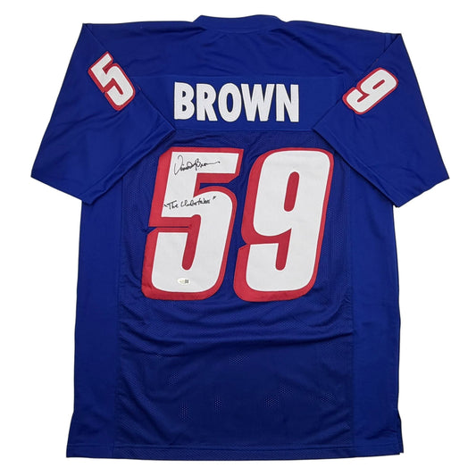 Blue New England Patriots football jersey numbered 59 with "BROWN" nameplate and autographed signature, displayed flat front view.