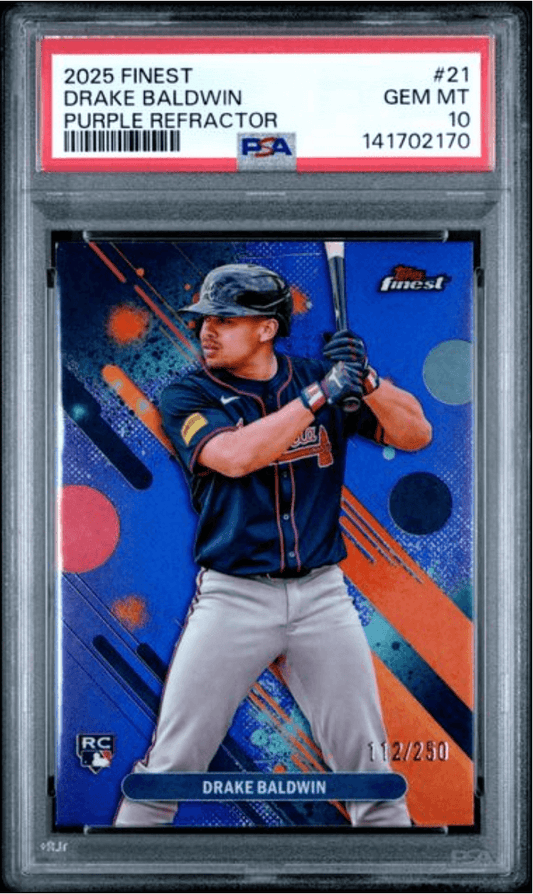 PSA-graded trading card in clear case showing Drake Baldwin in batting stance on blue and orange background with purple refractor finish and serial number 112/250.