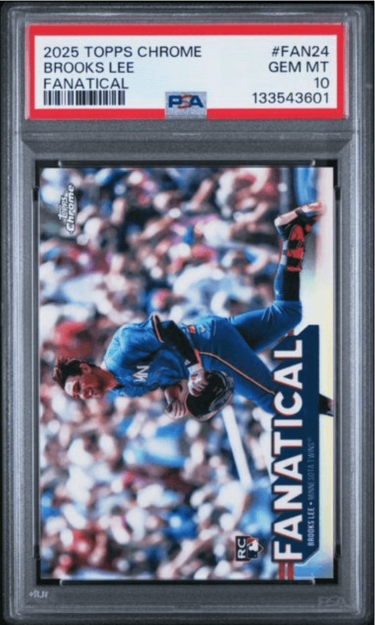 PSA-graded baseball card in plastic case showing Brooks Lee in blue uniform mid-swing against blurred crowd background, with "Fanatical" text visible.