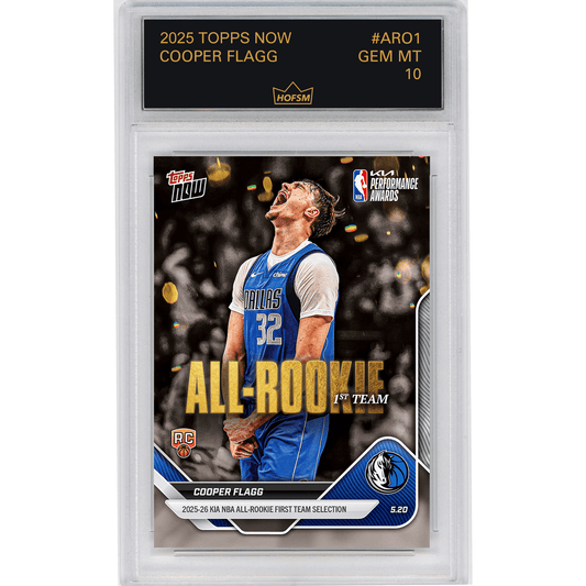 Graded trading card in clear plastic case showing Cooper Flagg in Dallas Mavericks blue jersey number 32, with gold "All-Rookie 1st Team" text and HOFSM 10 Gem Mint grade label.
