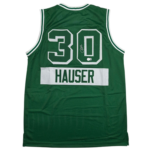 Back view of green mesh basketball jersey with white number 30, HAUSER nameplate, and autographed signature.