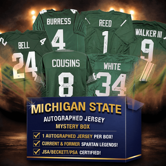 Six signed Michigan State green football jerseys displayed against dramatic lighting with mystery box promotional information below.