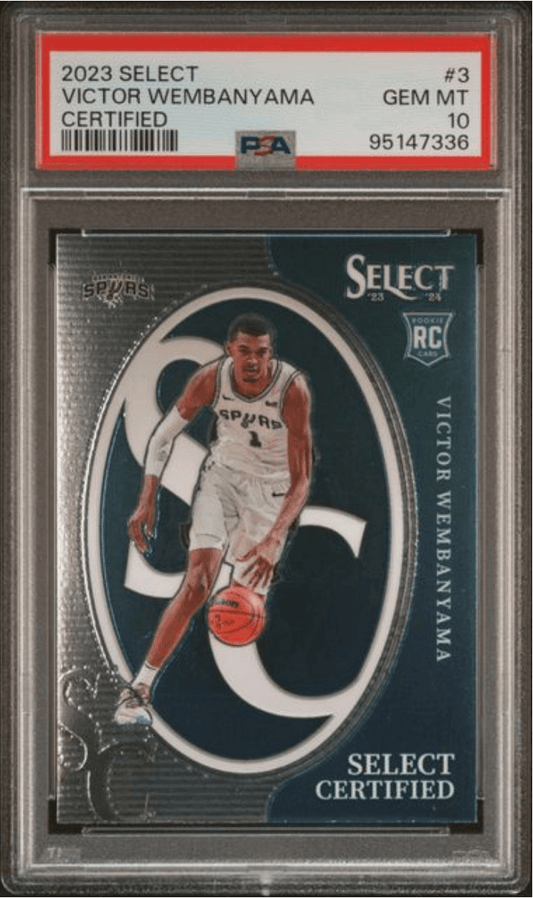 Front of graded basketball card showing Victor Wembanyama in white Spurs jersey within oval frame on dark teal background, with PSA grading label visible above.