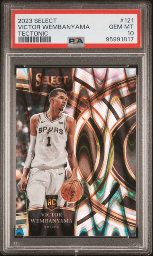 PSA-graded trading card in clear plastic case displaying Victor Wembanyama in white Spurs uniform against orange and teal geometric background design.