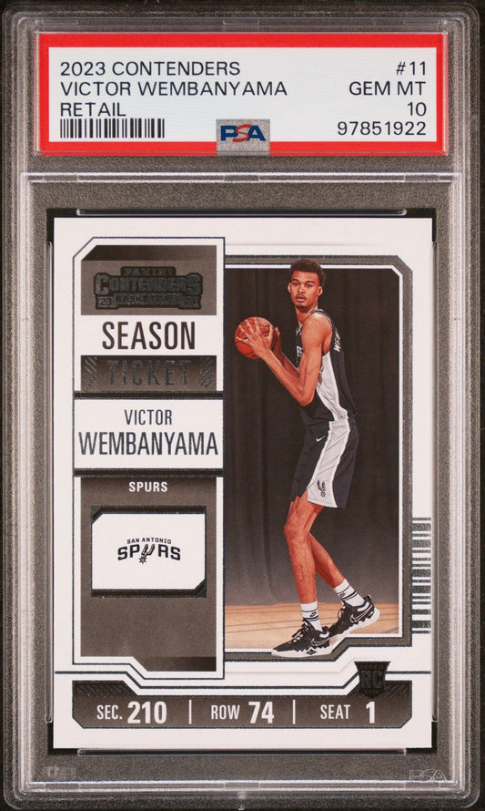 PSA-graded 2023 Panini Contenders Victor Wembanyama rookie card #11 in clear plastic case showing front design with player photo, season ticket styling, and San Antonio Spurs logo.