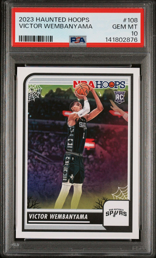 PSA-graded 2023 Haunted Hoops Victor Wembanyama rookie card in clear holder showing player shooting basketball in black Spurs uniform.