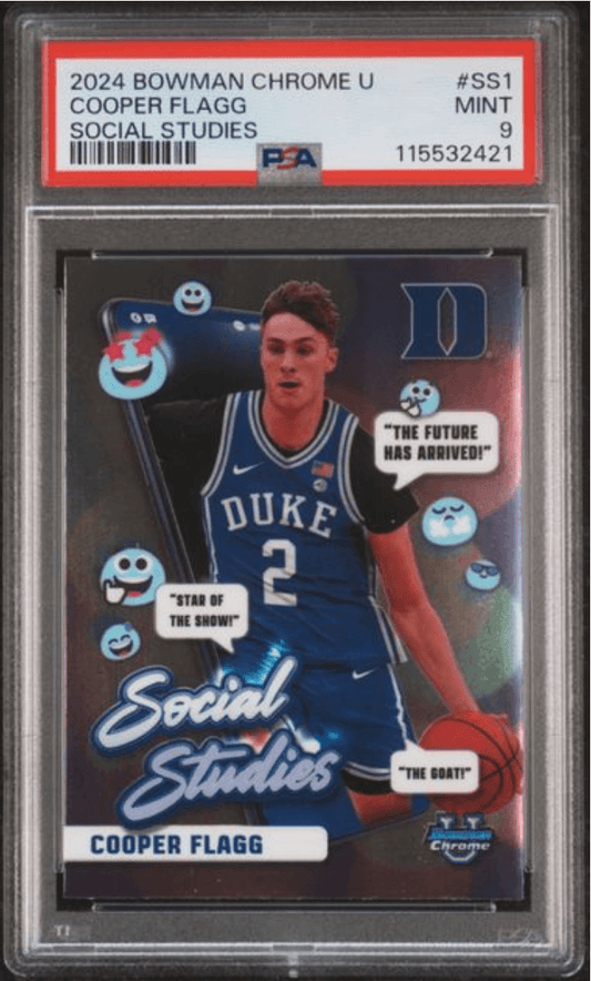 PSA-graded trading card in clear plastic case showing Cooper Flagg in Duke blue jersey with "Social Studies" overlay and cartoon character graphics.