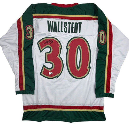 Back view of white hockey jersey with red number 30, green and burgundy trim, and "WALLSTEDT" nameplate.