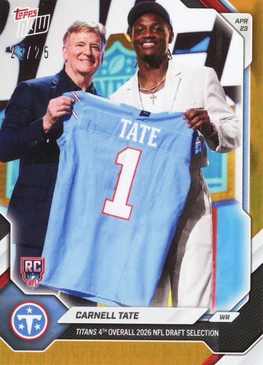 Carnell Tate holds light blue Titans jersey number 1 with team official at NFL draft podium, April 23.