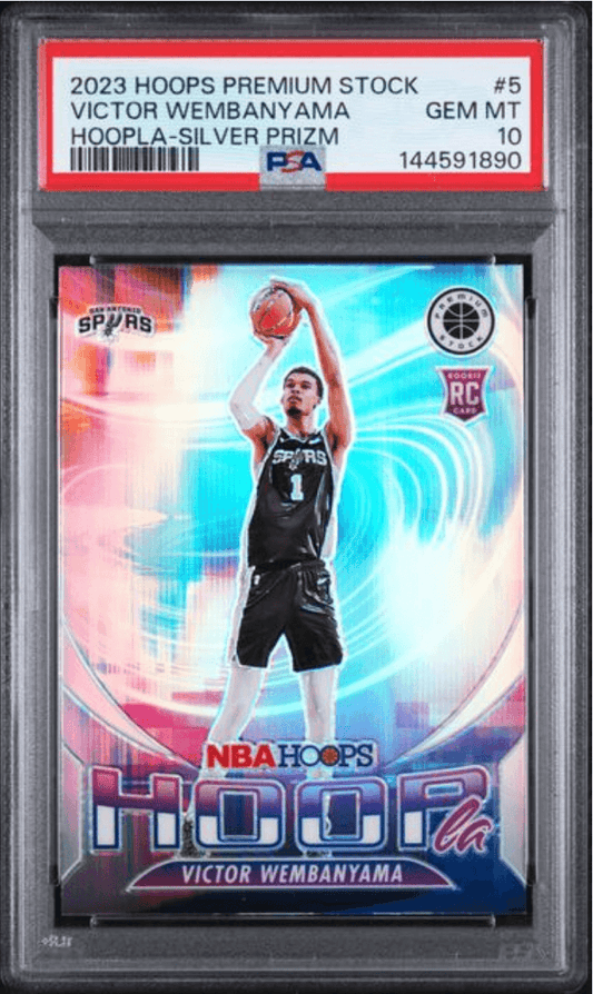PSA-graded trading card in clear plastic case showing Victor Wembanyama in Spurs uniform shooting basketball, silver prizm finish with colorful background.