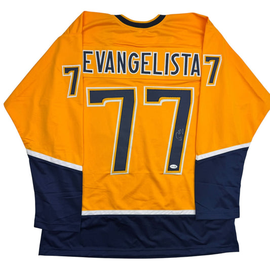 Back view of yellow and navy hockey jersey with "EVANGELISTA 7" and number 77 printed across shoulders and back.