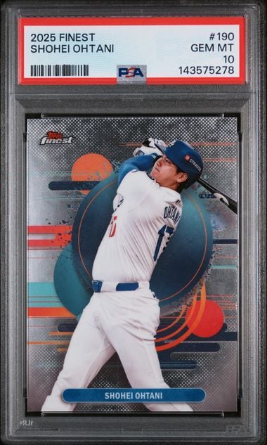 Graded PSA 10 baseball card in black holder showing Shohei Ohtani mid-swing in white uniform against colorful geometric background design.