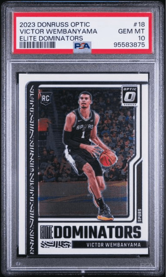 PSA graded rookie card in clear case showing Victor Wembanyama in Spurs black jersey dribbling basketball, with red grading label on top.