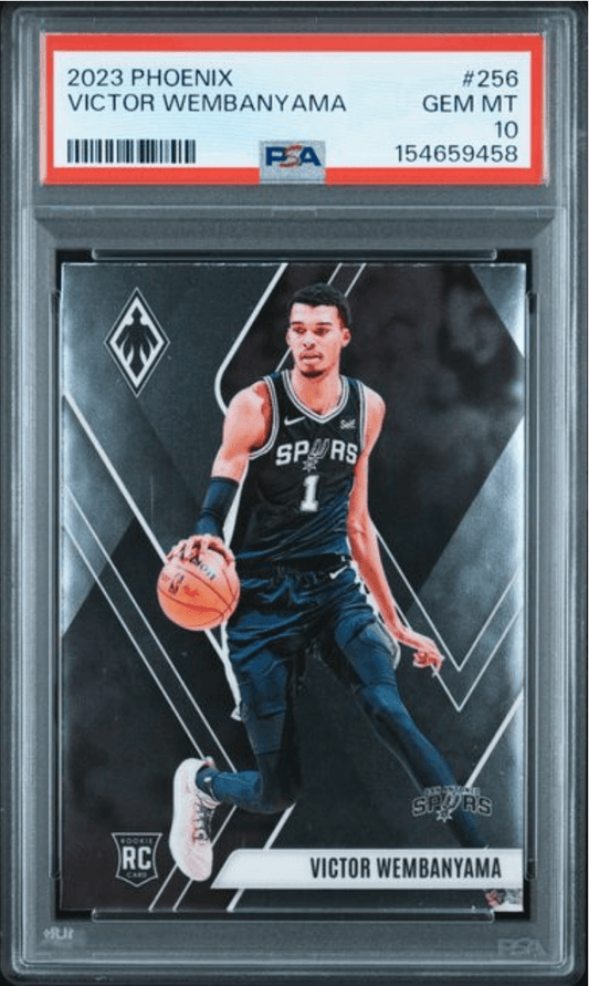 PSA-graded 2023 Phoenix basketball card featuring Victor Wembanyama in Spurs uniform dribbling ball, displayed in protective case.
