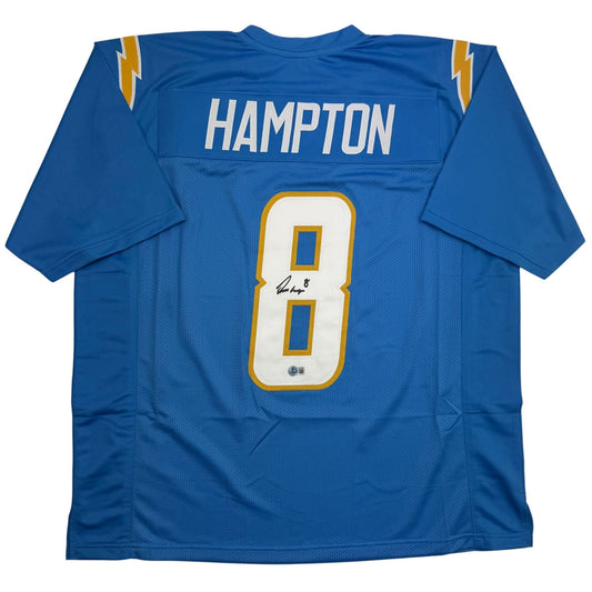 Back view of blue football jersey with "HAMPTON" and number 8 in white and gold, signed in black ink.