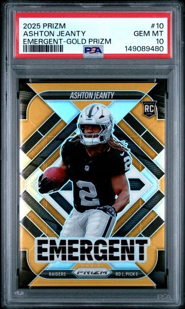 PSA-graded rookie card in clear plastic case showing Ashton Jeanty in Raiders uniform against gold and black geometric Prizm design.