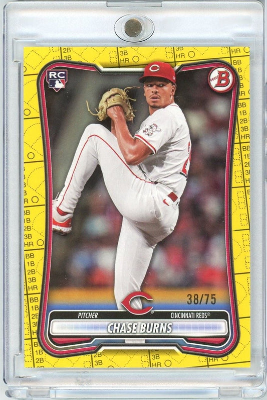 2026 Bowman Chase Burns rookie baseball card #38/75 in clear plastic case, showing pitcher in Cincinnati Reds white uniform mid-delivery against yellow scorecard border.