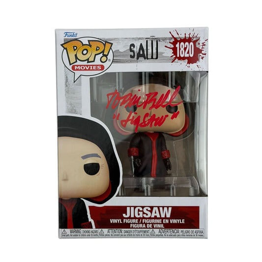 Front packaging view of autographed Jigsaw Funko Pop #1820 figure with red signature visible on vinyl head.