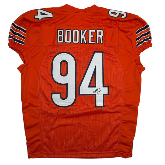 Back view of signed orange Chicago Bears pro cut football jersey number 94 with "BOOKER" nameplate.