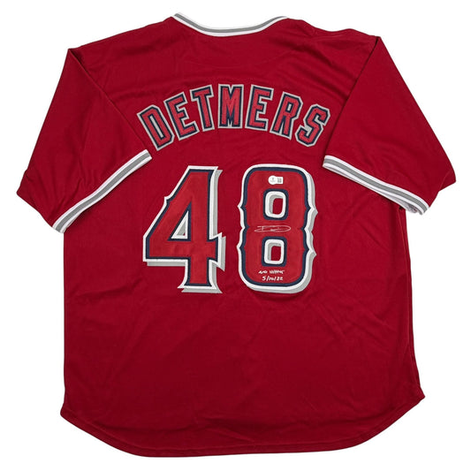 Back view of red baseball jersey displaying "DETMERS" and number 48 in gray and white lettering with striped sleeve trim.