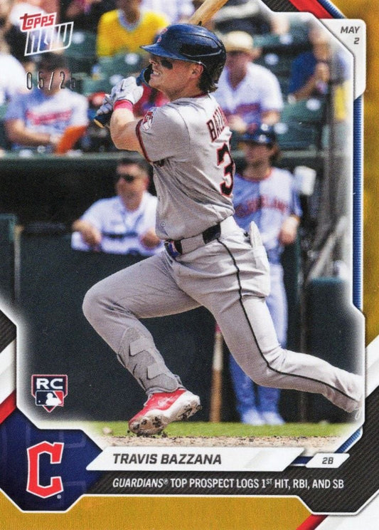 Travis Bazzana mid-swing in gray Guardians uniform, blue helmet, red cleats, stadium background, Topps card with orange foil border and RC logo.