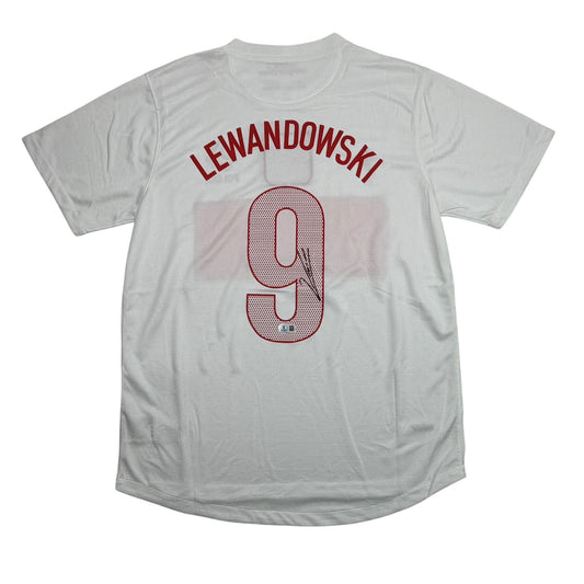 White soccer jersey displayed flat featuring "LEWANDOWSKI" and number "9" in red lettering on chest.