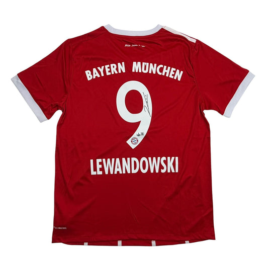 Back view of red Bayern Munich jersey with white "LEWANDOWSKI" name and number 9, white collar trim visible.