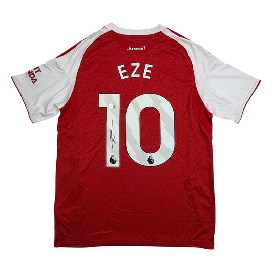 Back view of red and white Arsenal jersey numbered 10 with "EZE" nameplate and player signature on number.