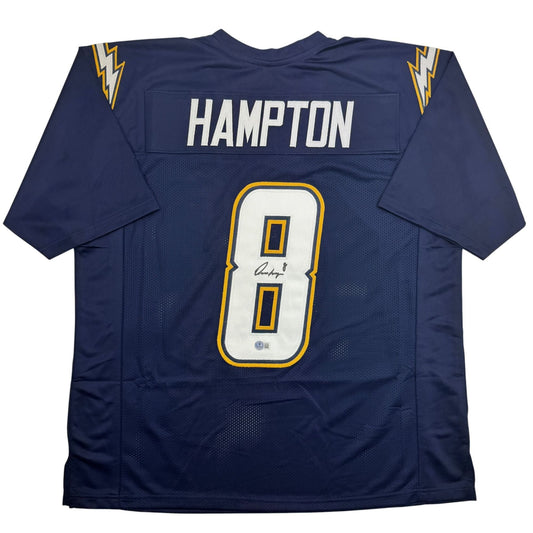 Back view of navy blue football jersey with "HAMPTON" nameplate and signed number 8 in white and gold trim.