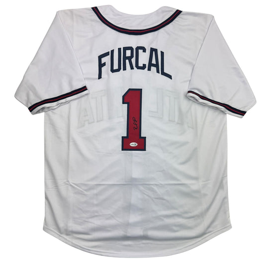 Back view of signed white Atlanta Braves baseball jersey number 1 with "FURCAL" nameplate and navy blue trim.
