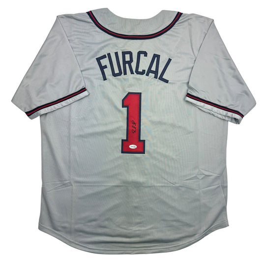 Gray baseball jersey with "FURCAL" and red number "1" on back, navy trim, signed in blue ink.