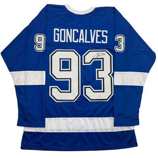 Back view of blue and white Goncalves hockey jersey with number 93 and signature visible on white chest numbers.