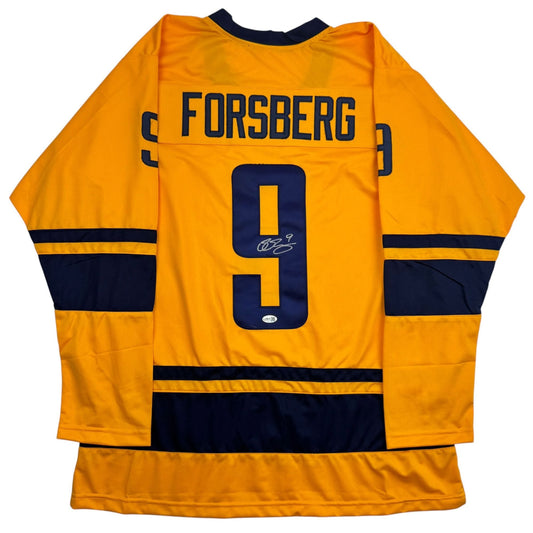 Back view of yellow and navy hockey jersey with "FORSBERG" and number 9 with autographed signature.