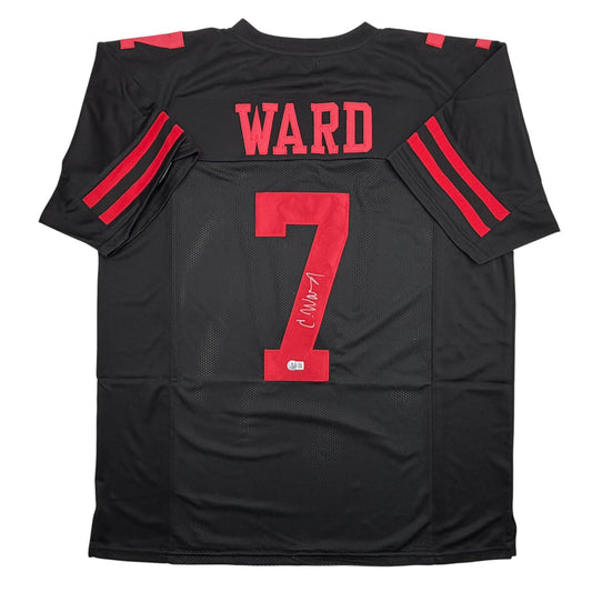 Back view of black football jersey with red "WARD" name and number "7" with autograph on mesh fabric.