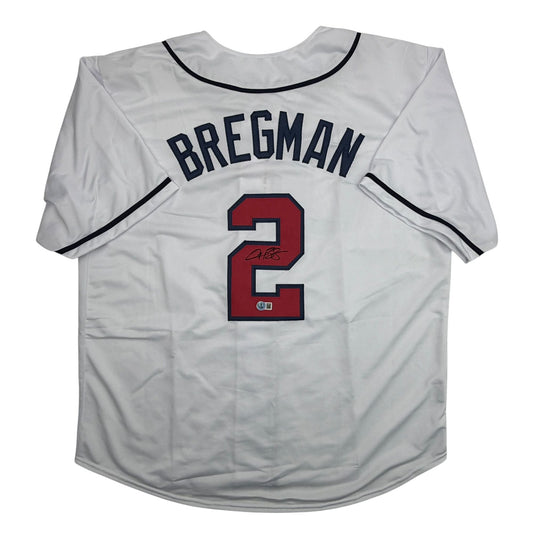 White baseball jersey displayed flat with "BREGMAN" and number 2 in red and navy, featuring autographed signature and authentication badge on back view.