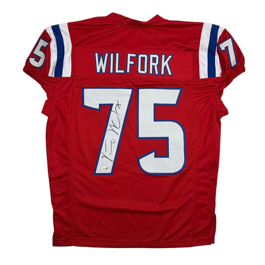 Back view of red New England Patriots jersey number 75 with "WILFORK" nameplate and autographed signature stripe.