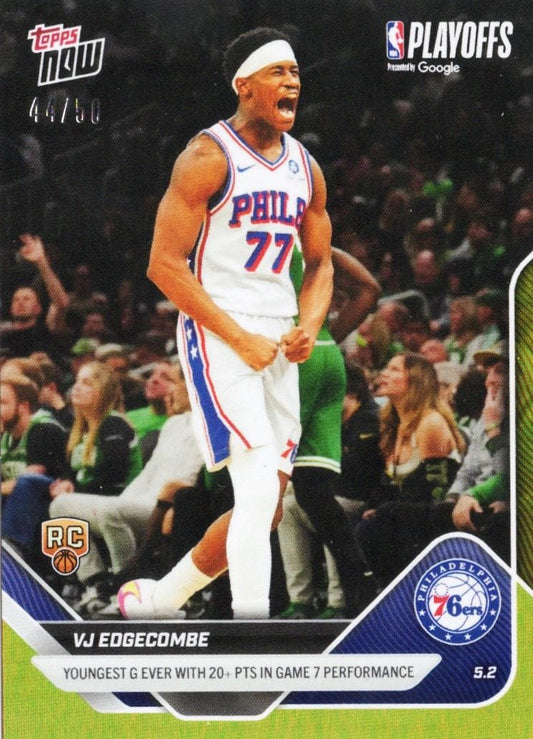 Philadelphia 76ers player VJ Edgecombe wearing white jersey number 77 celebrating during playoff game with crowd visible behind.