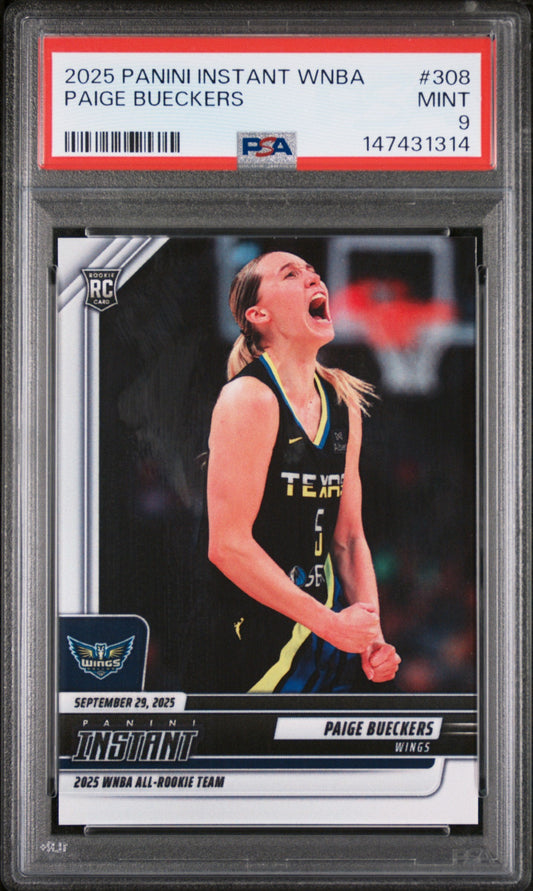 Graded PSA 9 Mint rookie card in plastic holder showing Paige Bueckers in Dallas Wings black jersey, head tilted back with fist clenched.