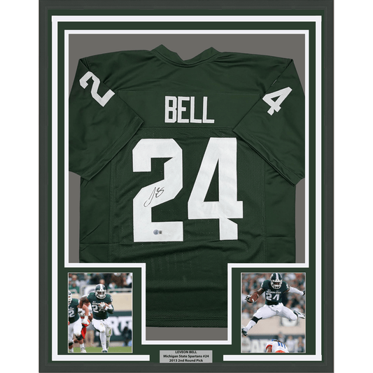 Framed dark green Michigan State football jersey #24 signed by Le'Veon Bell, displayed with two action photos and nameplate below.