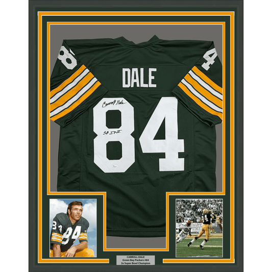 Framed green and gold Green Bay Packers jersey number 84 signed by Carroll Dale, displayed with two photographs and an informational plaque.