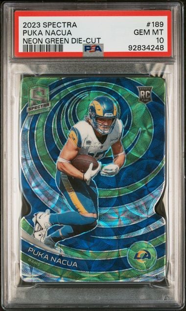 PSA-graded trading card in protective case displaying neon green die-cut football card of player in blue and yellow uniform against swirling blue-green background.