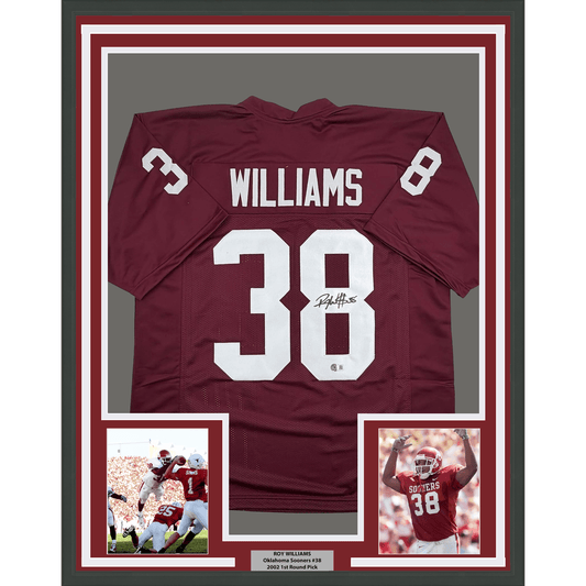 Framed maroon Oklahoma Sooners #38 football jersey signed by Roy Williams, displayed with two accompanying photographs and nameplate.