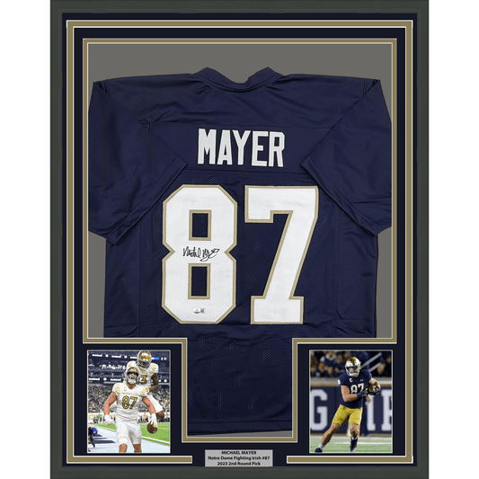Navy blue Notre Dame #87 football jersey signed by Michael Mayer, framed with photos and nameplate.