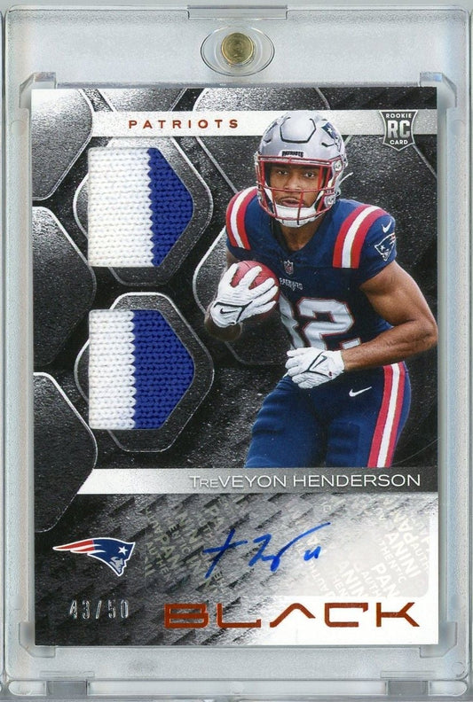 Front of graded trading card showing Treveyon Henderson in Patriots uniform with dual jersey swatch patches and blue autograph, numbered 43/50.