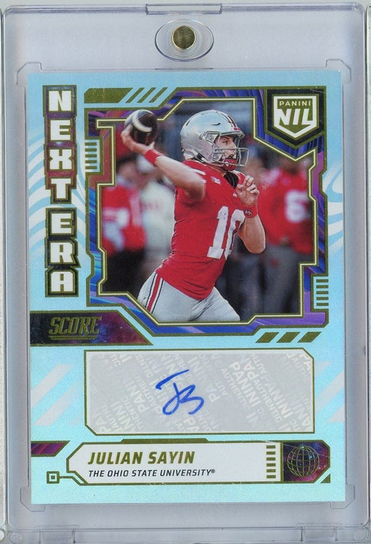 Front of a light blue football trading card featuring Julian Sayin in red Ohio State uniform throwing a football, with blue autograph and gold foil borders.