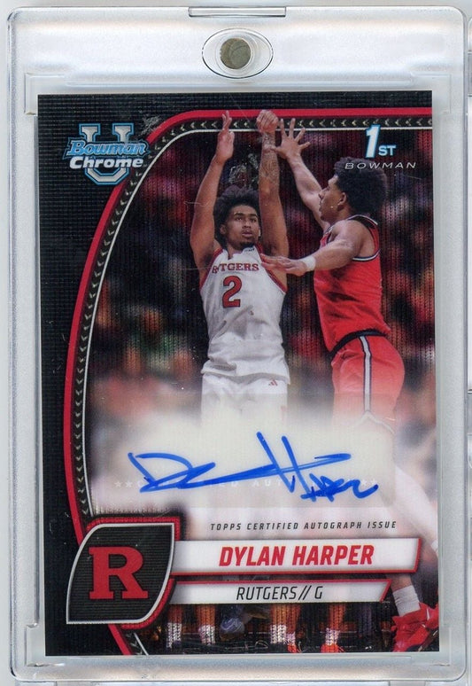 Signed Bowman Chrome basketball card showing Dylan Harper in white Rutgers jersey shooting over defender in red, with blue autograph and "1ST BOWMAN" designation visible.