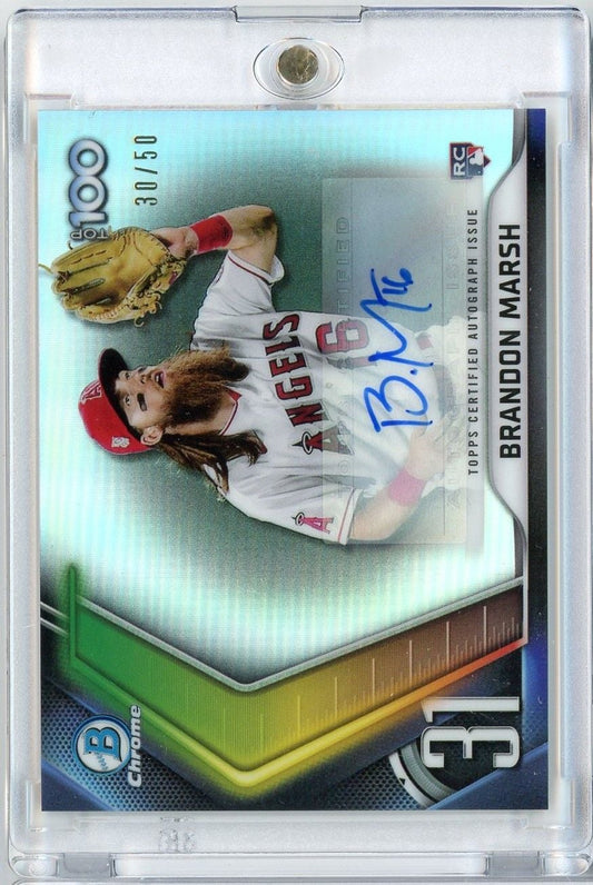 Graded baseball card in clear plastic case showing autographed rookie card of player in red Angels uniform with glove, blue signature visible on turquoise background.