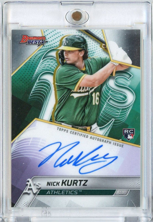 Signed 2025 Topps Bowman's Best baseball card featuring Nick Kurtz in green Oakland Athletics uniform, mid-swing, with blue autograph on white lower section.