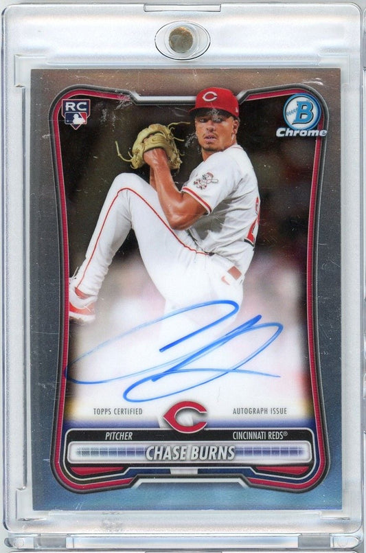 Signed 2026 Topps Bowman Chrome rookie card of Cincinnati Reds pitcher Chase Burns in white uniform mid-pitch, blue autograph visible.