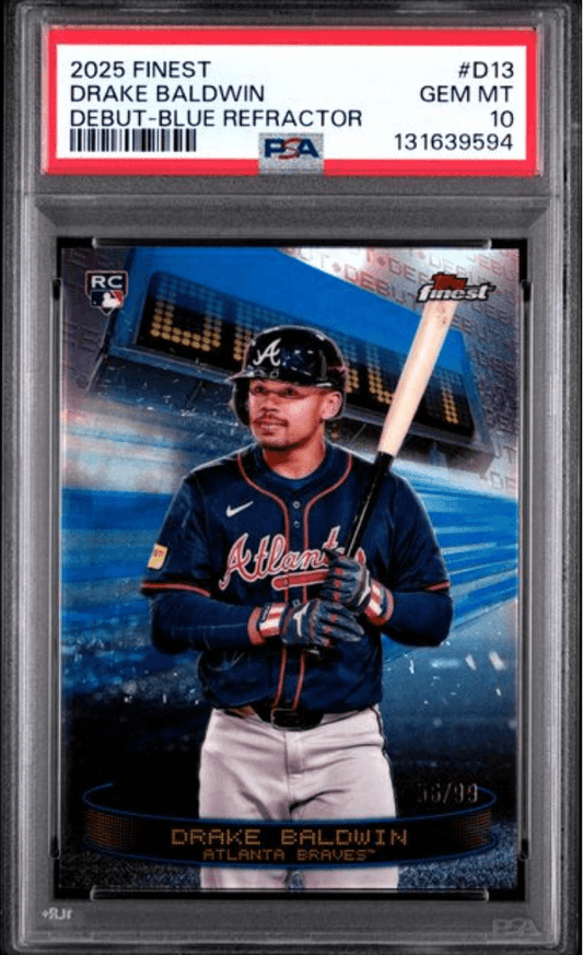 PSA-graded Drake Baldwin rookie card in clear plastic case showing front with player in Atlanta Braves uniform holding bat against blue stadium background.